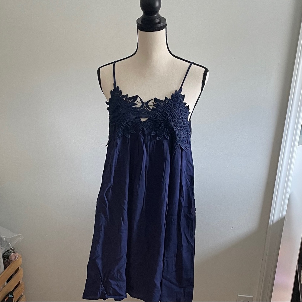 Navy dress with appliqué neckline